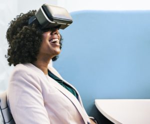 a woman uses a virtual reality headset